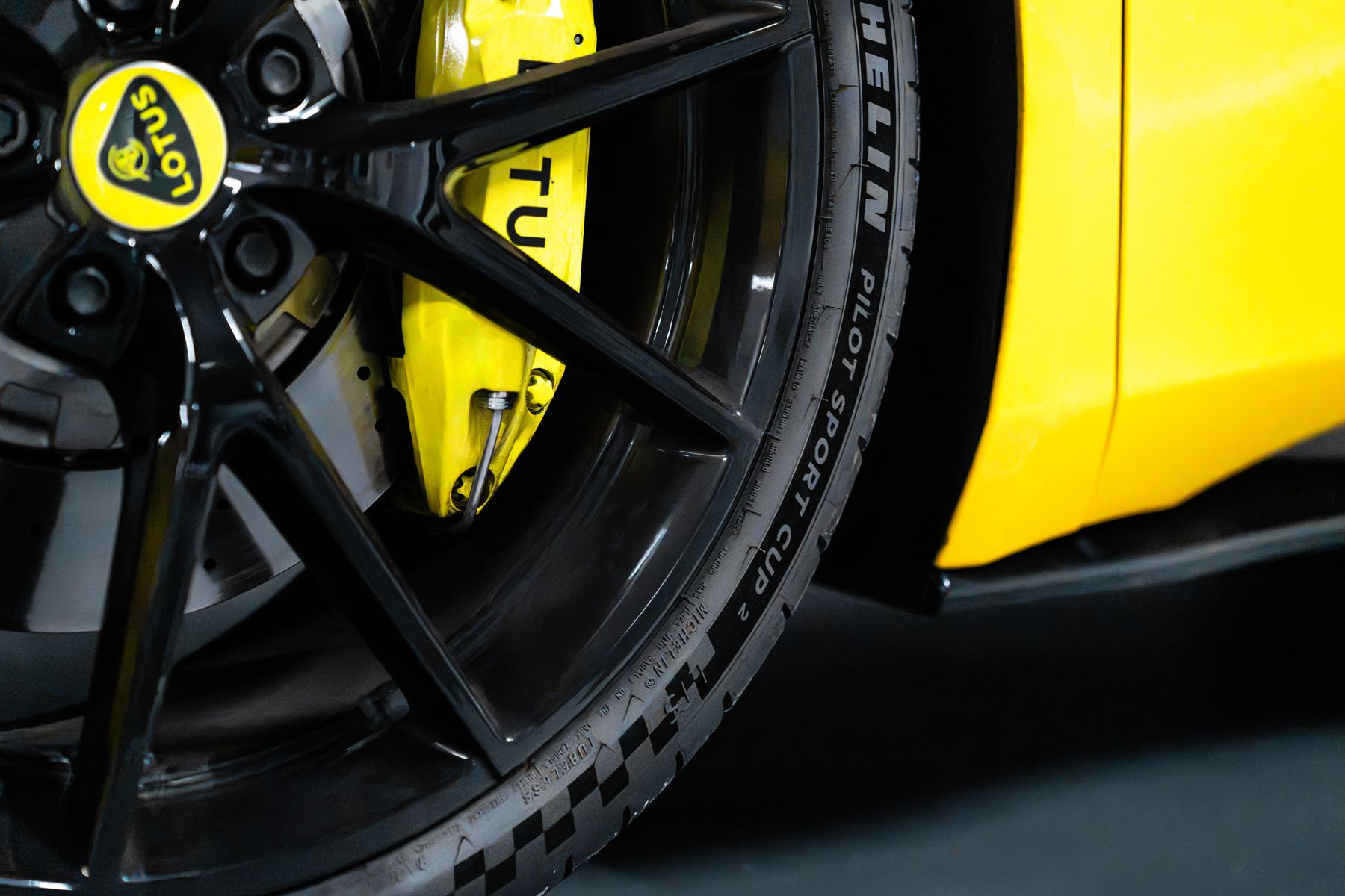 Wheel and yellow brake caliper of the Lotus Emira